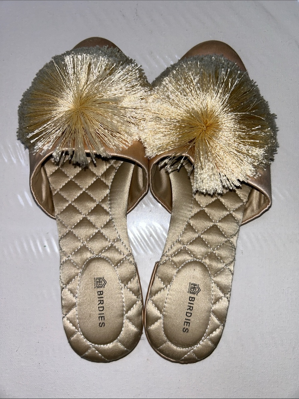 Birdies The Songbird Slides Champagne Satin Metallic Gold Quilted Pom Pom Slide